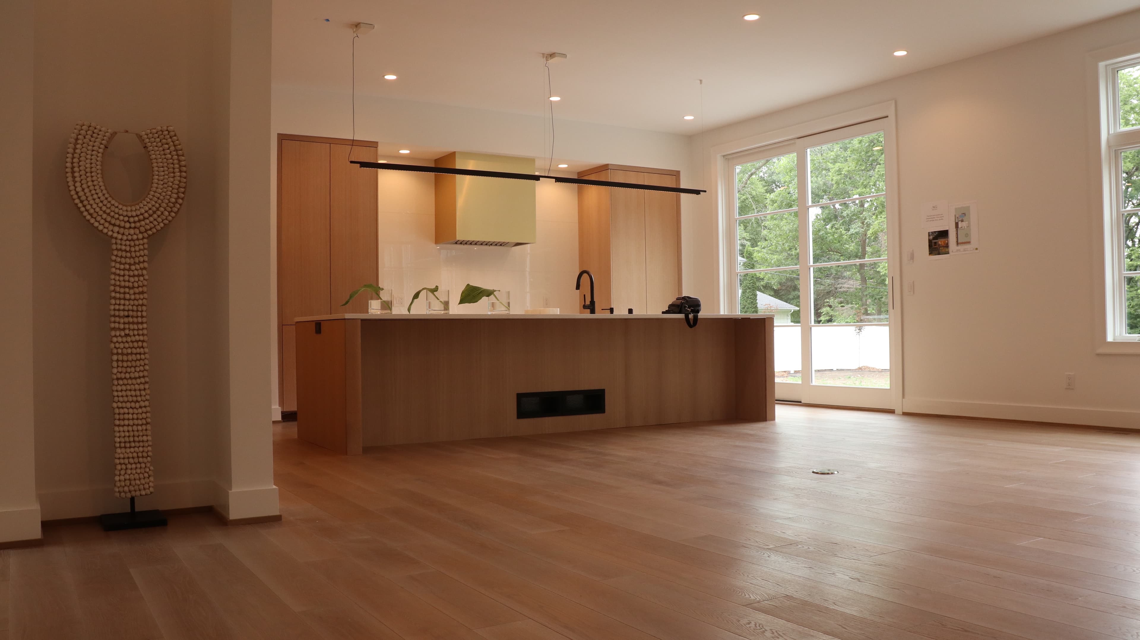 Freshly refinished hardwood floor in a bright living room